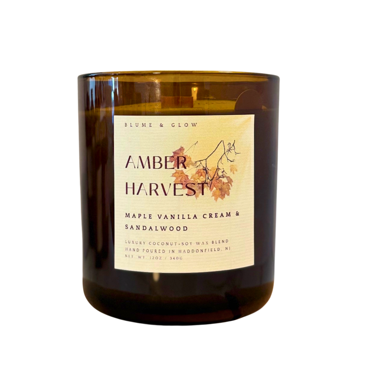 Blume & Glow Amber Harvest candle with wooden wick in translucent amber jar