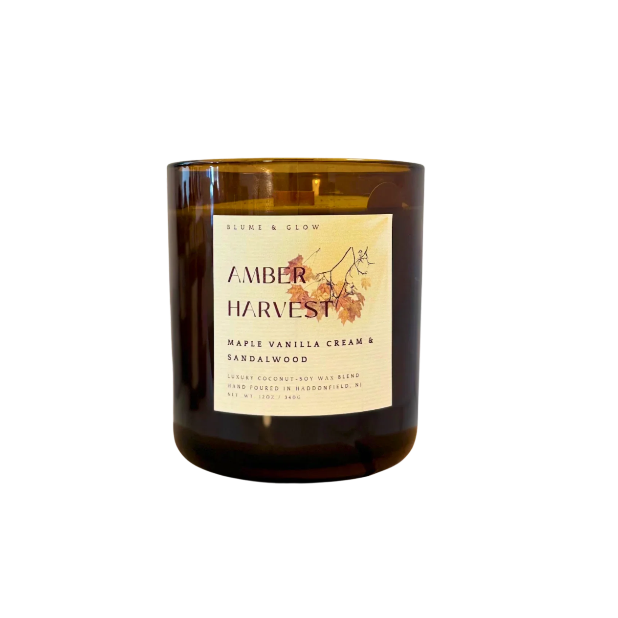 Blume & Glow Amber Harvest candle with wooden wick in translucent amber jar