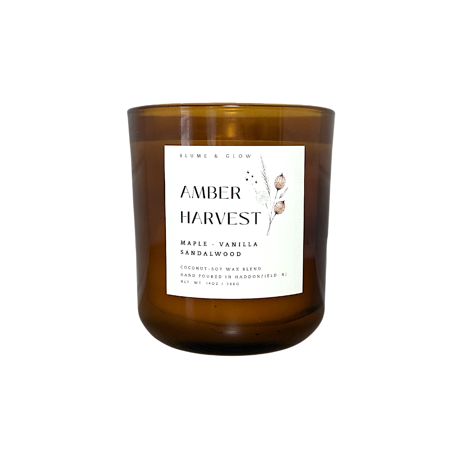 Amber Harvest maple cinnamon and vanilla autumn candle by Blume & Glow with wooden wick in a translucent amber jar