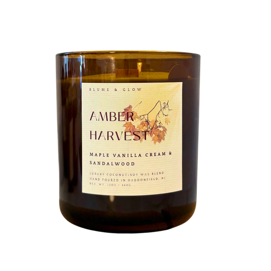 Blume & Glow Amber Harvest candle with wooden wick in translucent amber jar