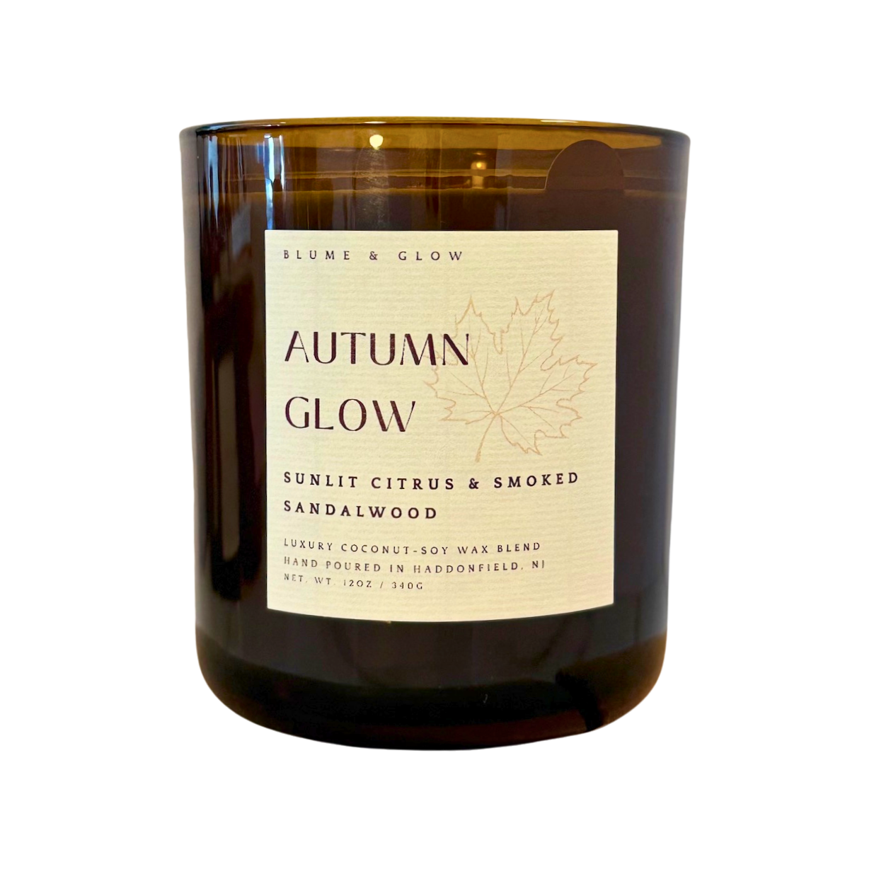 Blume & Glow Autumn Glow candle with wooden wick in translucent amber jar