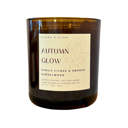Blume & Glow Autumn Glow candle with wooden wick in translucent amber jar