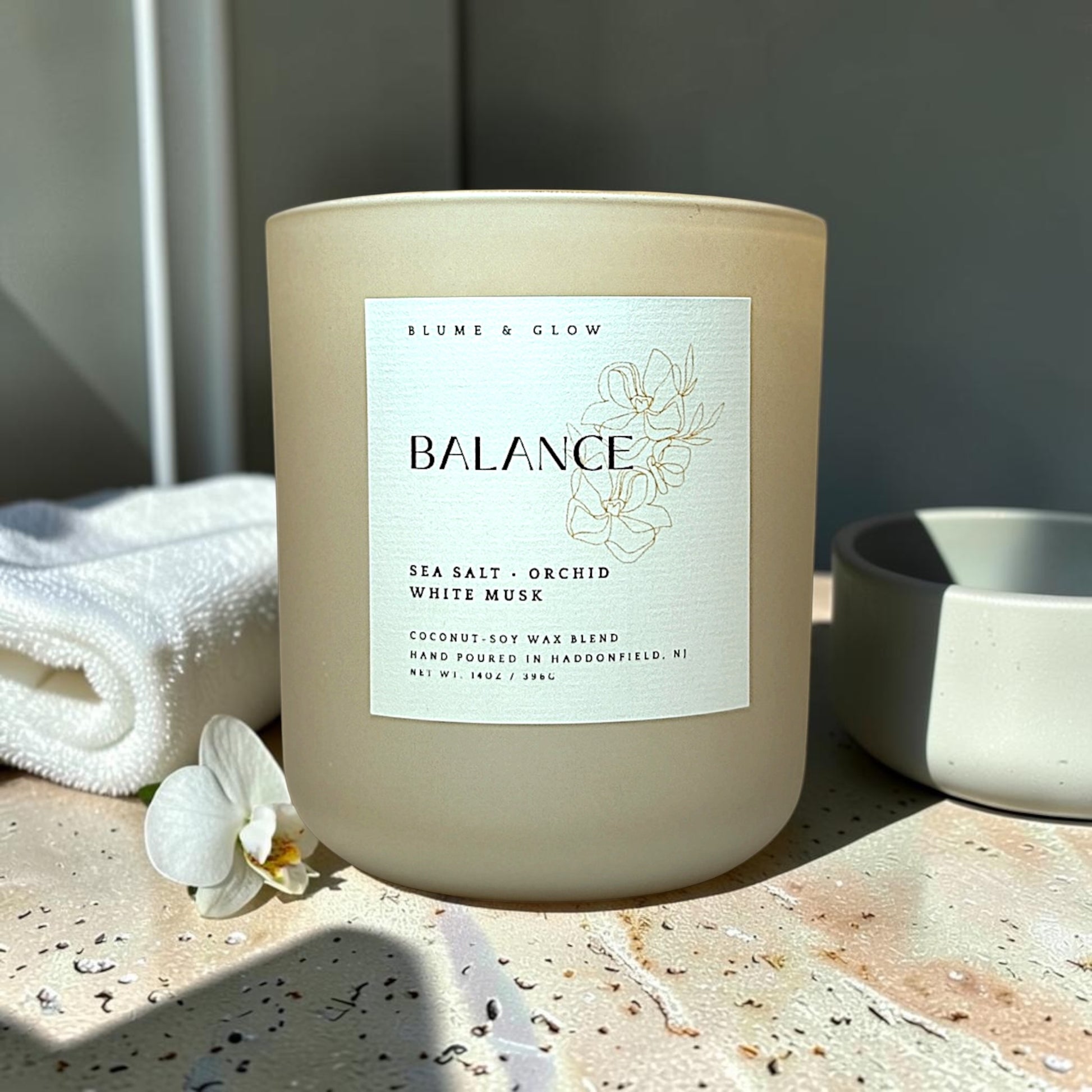 Balance candle in calming bathroom with orchid