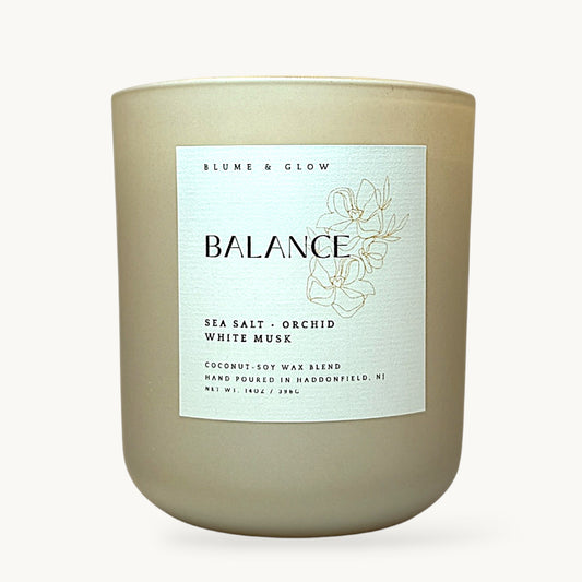 Balance sea salt orchid musk candle by Blume & Glow with wooden wick in cream jar