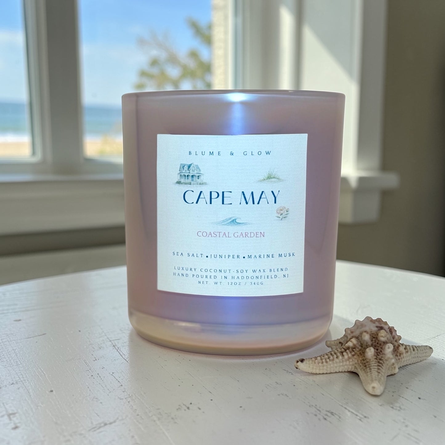 Cape May coastal candle by Blume & Glow burning with a crackling wooden wick, bergamot and sea salt fragrance