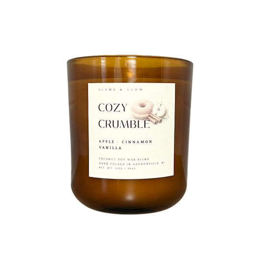 Cozy Crumble baked apple cinnamon and vanilla candle by Blume & Glow with wooden wick in a translucent amber jar