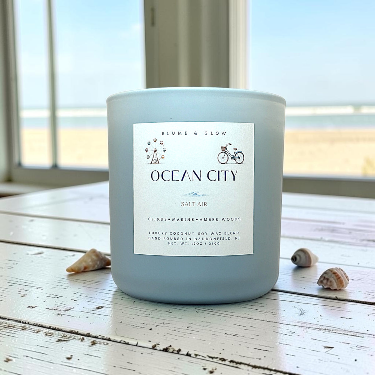 Ocean City coastal citrus candle by Blume & Glow burning in beach house aesthetics decor