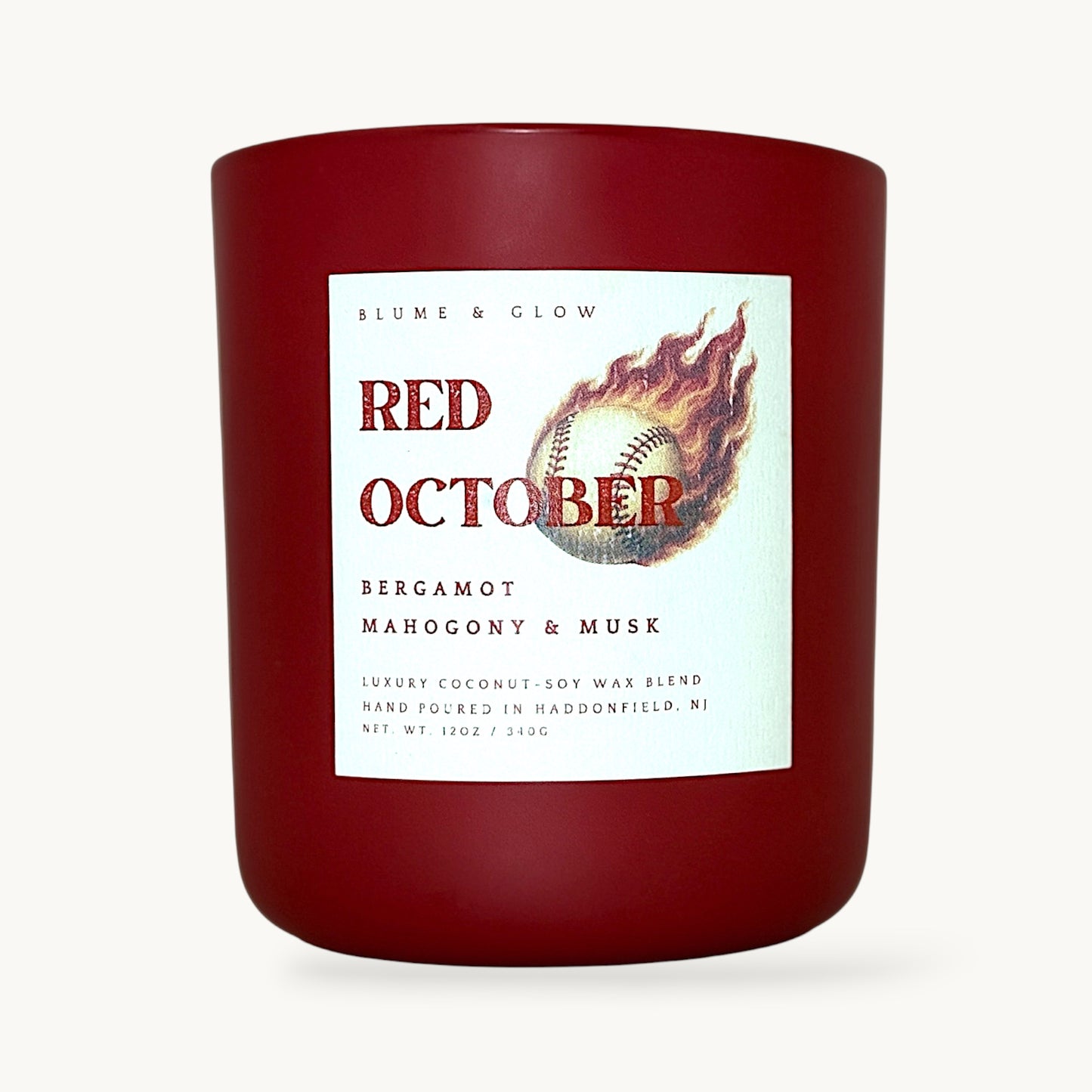 Red October Philadelphia baseball candle by Blume & Glow in a red glass jar with bergamot, mahogany and musk scent