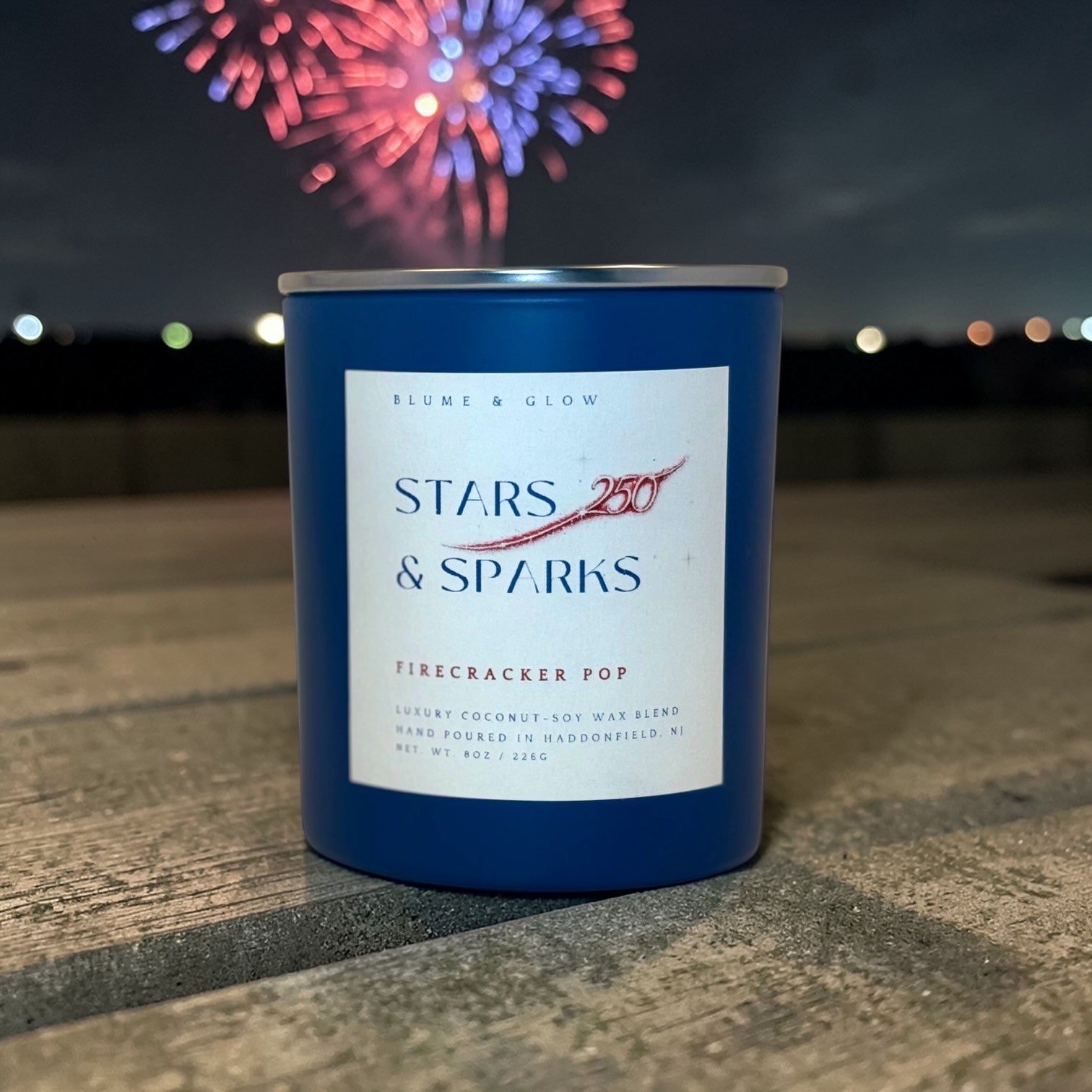 Stars & Sparks America 250 commemorative candle label detail featuring patriotic red white and blue fireworks design by Blume & Glow